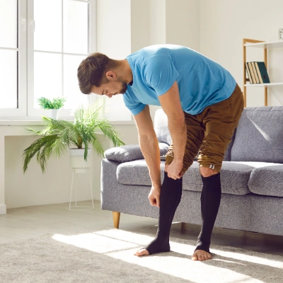 man with compressions socks west coast wound care